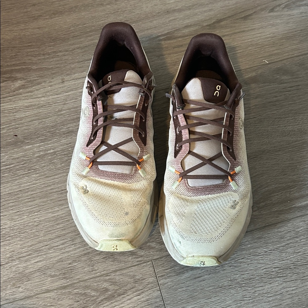 On Running Cream and Brown Athletic Shoes